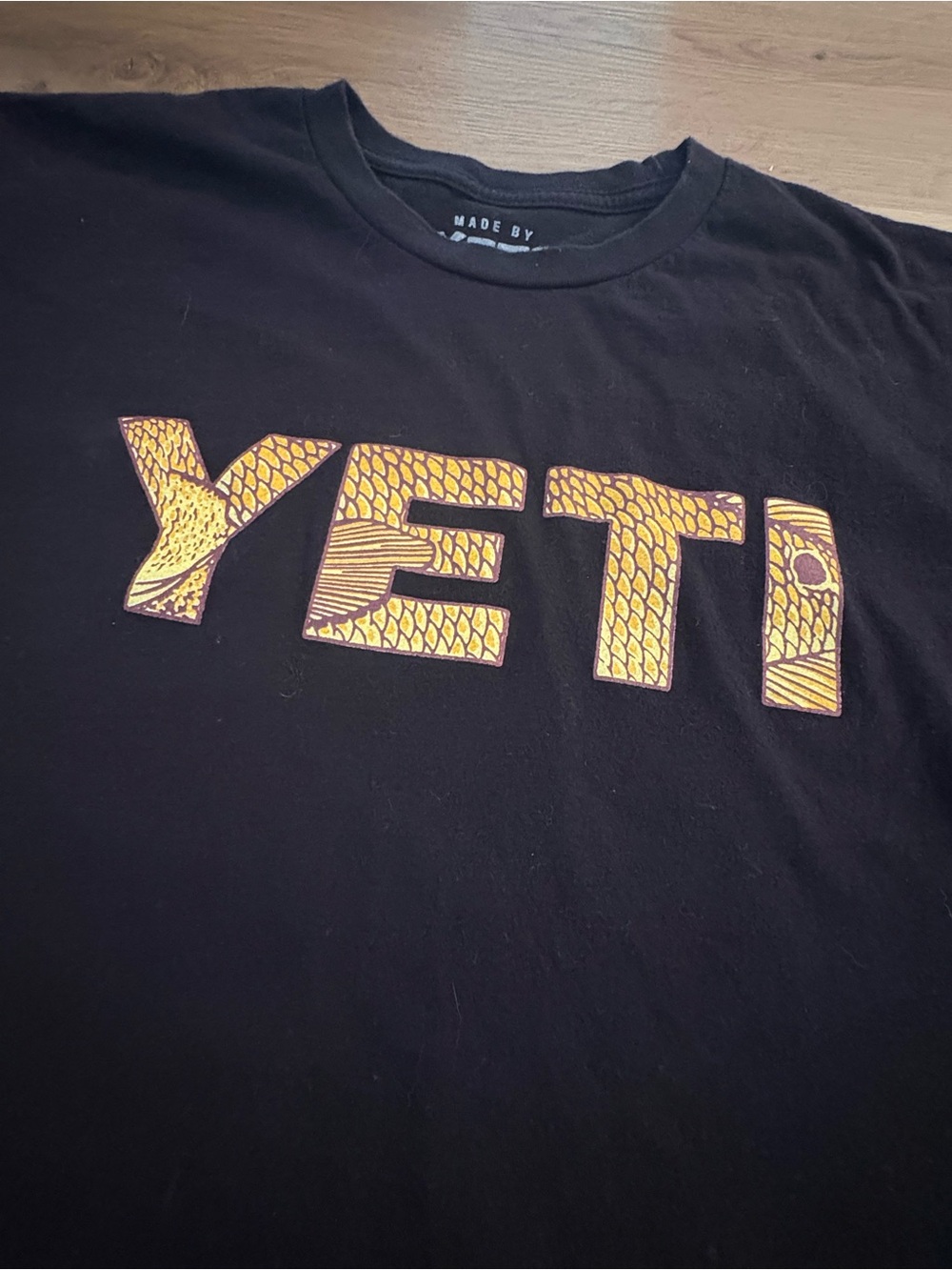 Yeti Black Tee with Yellow Fish Scale Patterned Logo Size Medium